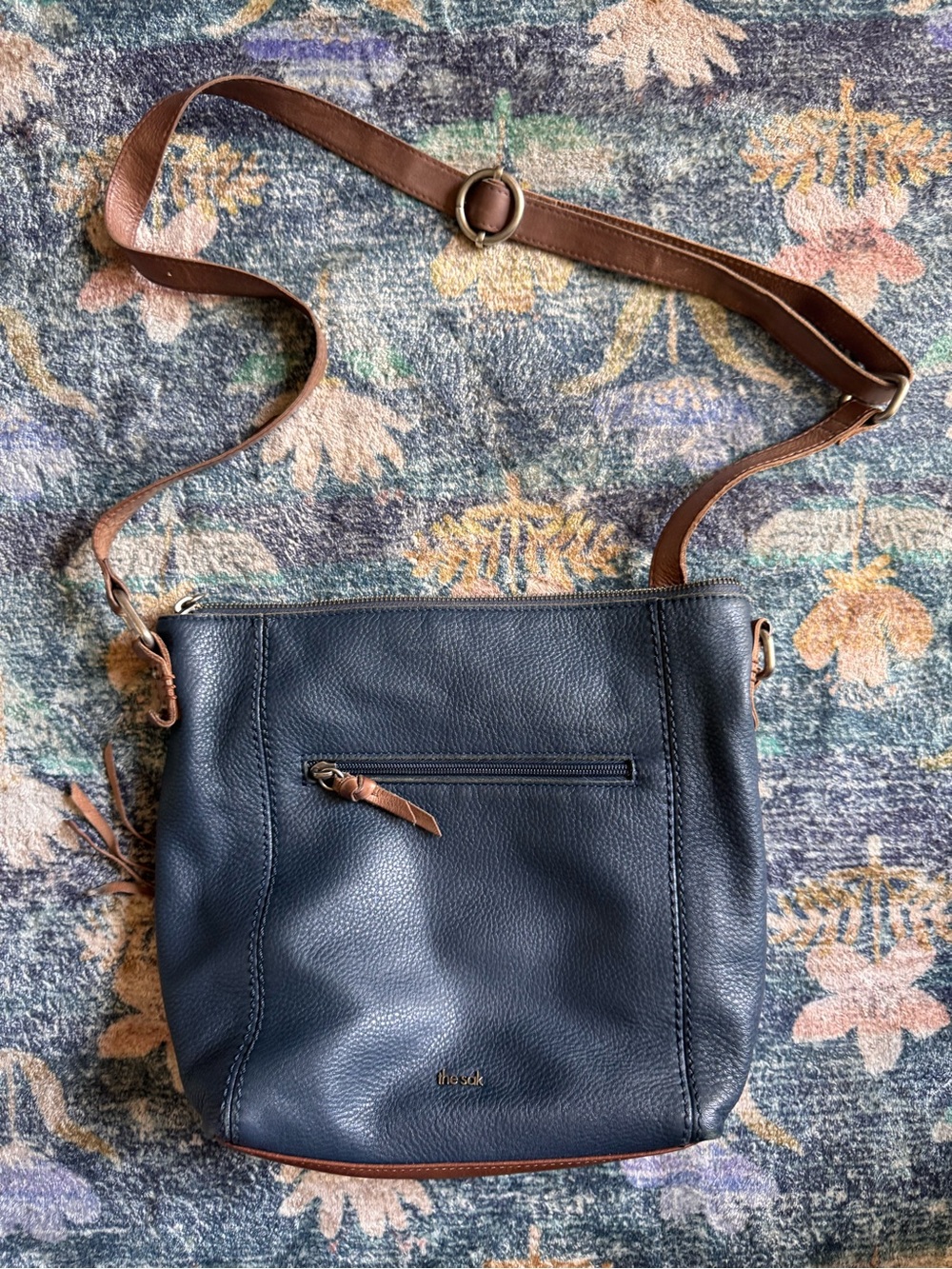 The Sak Navy Pebbled Leather Crossbody with Brown Trim